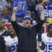 The Detroit Lions celebrate as head coach Dan Campbell is named the 2024 NFL Coach of the Year and the team achieves a historic victory.