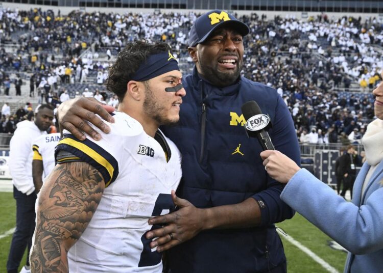 Michigan coach Sherrone Moore breaks down in tears on live TV after win over Penn State as Jim Harbaugh suspended