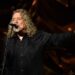 Robert Plant, the legendary lead singer of Led Zeppelin, was famously known for his magnetic stage presence and wild charisma, which captivated countless fans—especially women. With his flowing golden curls, bare-chested performances, and soulful, powerful voice, Plant embodied the ideal of the 1970s rock god. His poetic lyrics and uninhibited energy added to his mystique, making him an icon of raw sensuality and emotional depth that resonated deeply with his admirers.Back by popular demand! I know this one’s not for everyone, but for those who loved it, it’s available again. Who’s grabbing one?   Get yours here:
